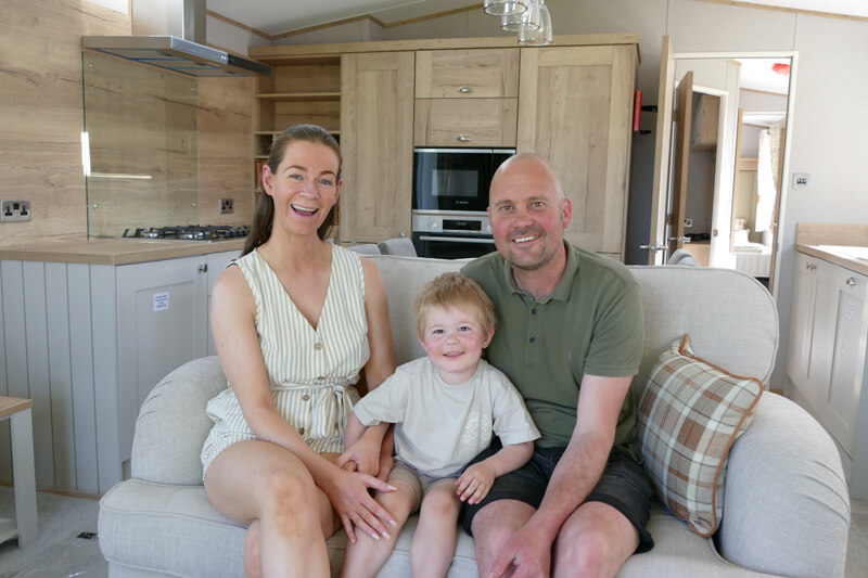 Anjya and Gavin with son in caravan